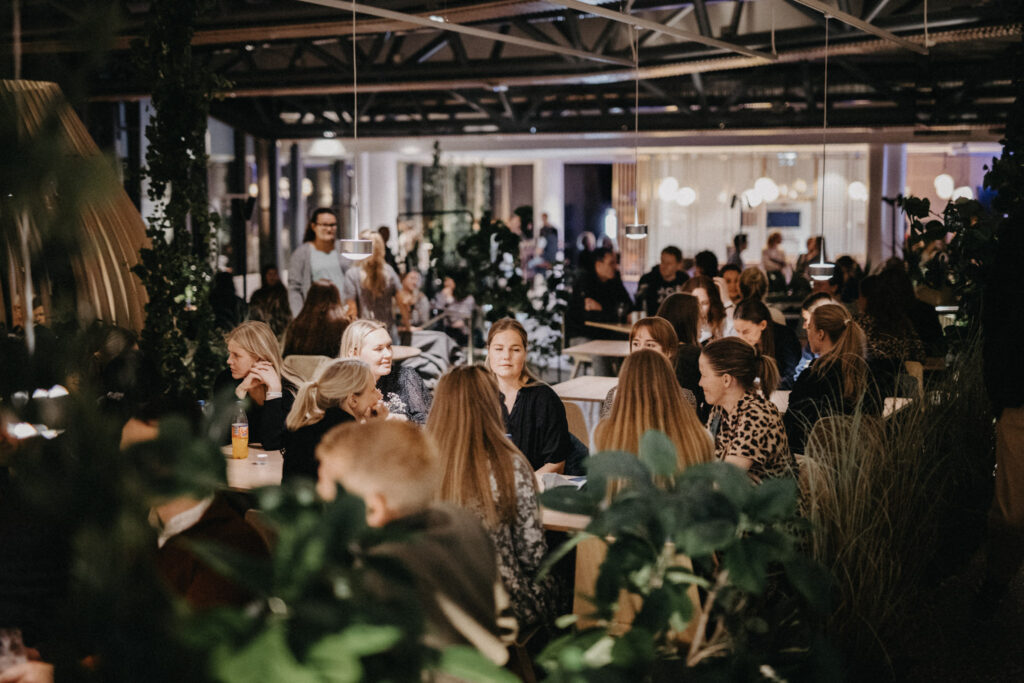 The conversation flows easily around the tables.