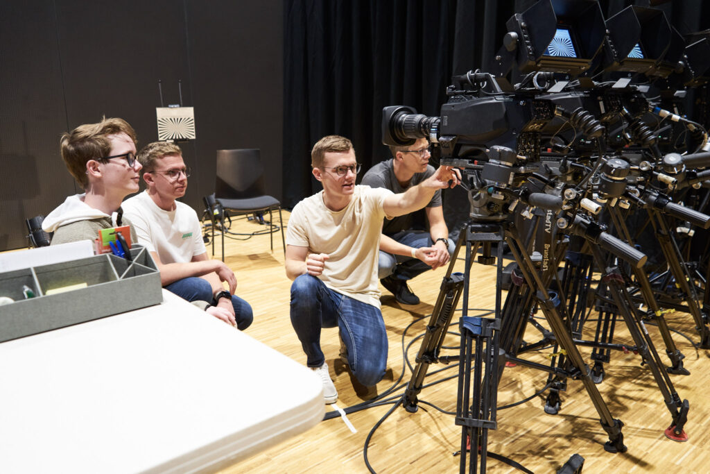 Training in sound, lighting, and video production during the volunteer weekend.