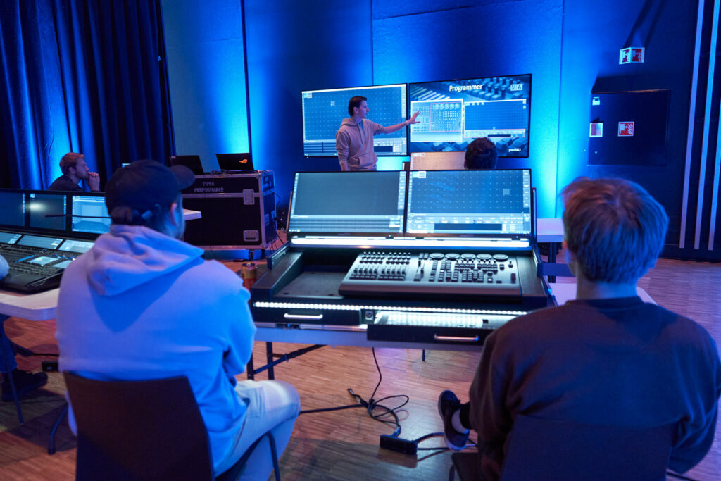 Training in sound, lighting, and video production during the volunteer weekend.